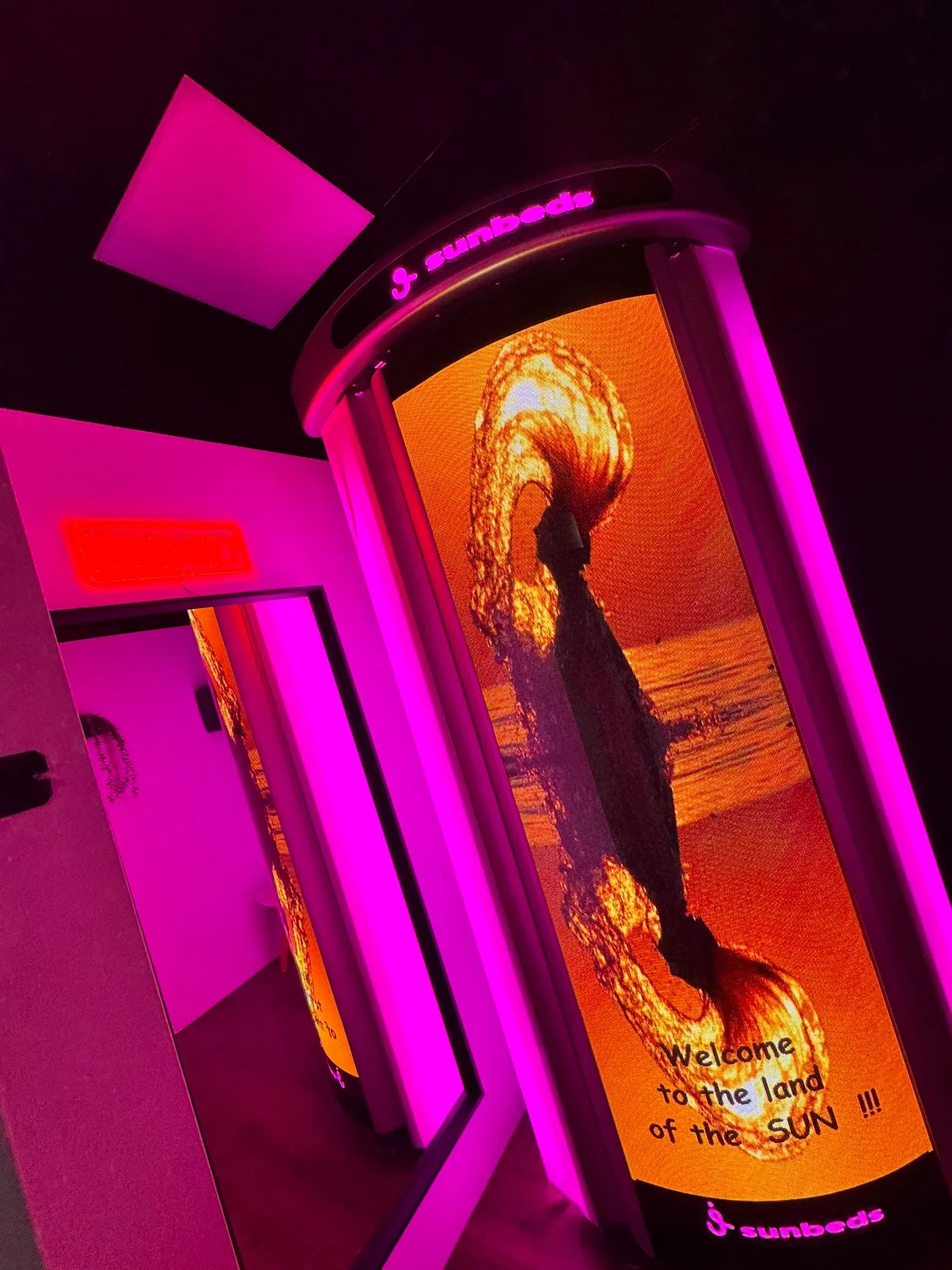 Opal Fitness stand-up sunbed with full LED screen at Luxe Glow Studio
